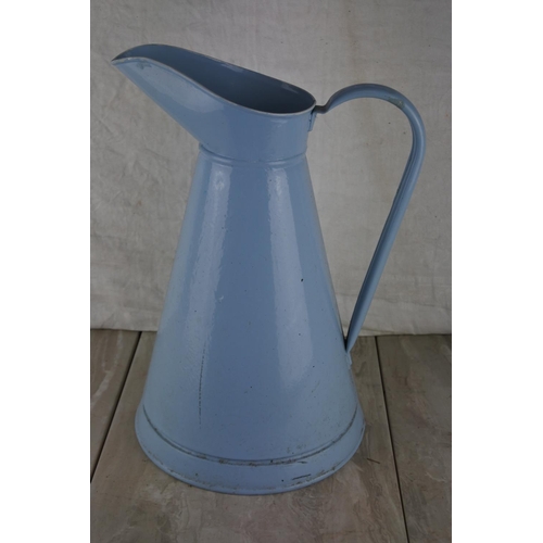 340 - A blue enamel water pail. Approx 40cm.