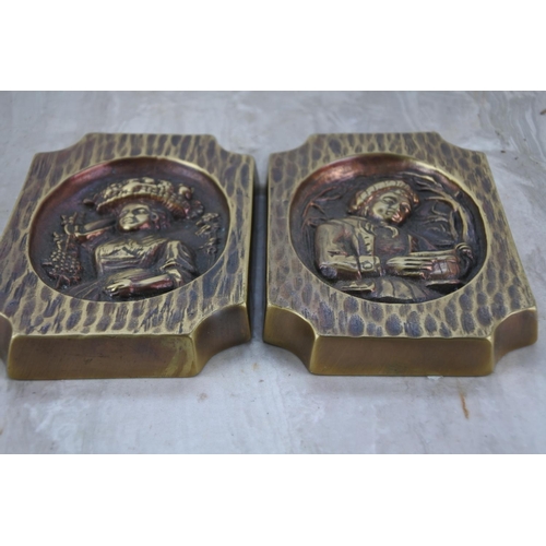 350 - Two brass figurine plaques.