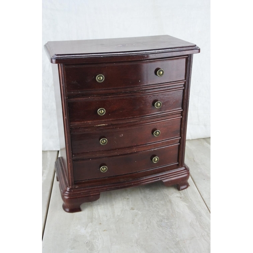 353 - A four drawer jewellery chest. Approx 26x29x15cm.