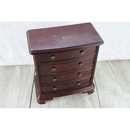 353 - A four drawer jewellery chest. Approx 26x29x15cm.