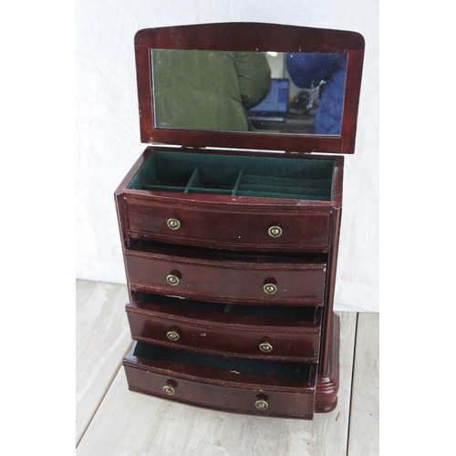 353 - A four drawer jewellery chest. Approx 26x29x15cm.