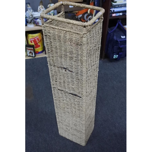 360 - A metal and wicker storage unit. Approx 22x86x16cm.