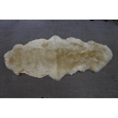 371 - A vintage sheepskin rug.