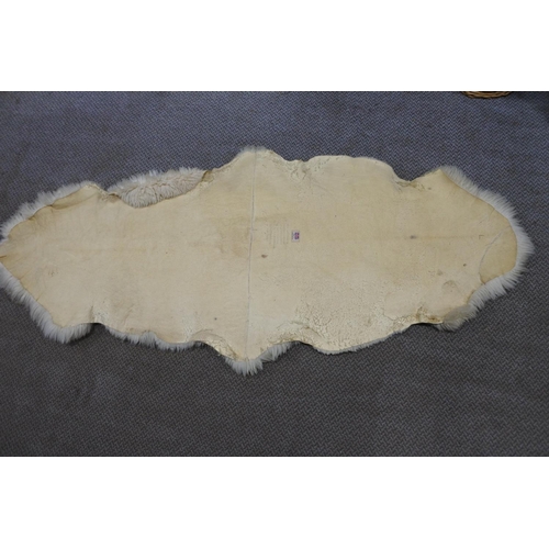 371 - A vintage sheepskin rug.