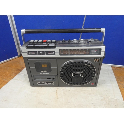 Portable radio cassette player made by the Sharp Corporation, radio cassette  