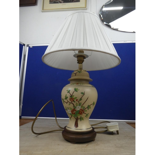 453 - A stunning floral patterned ceramic based table lamp and shade. Approx 48cm.