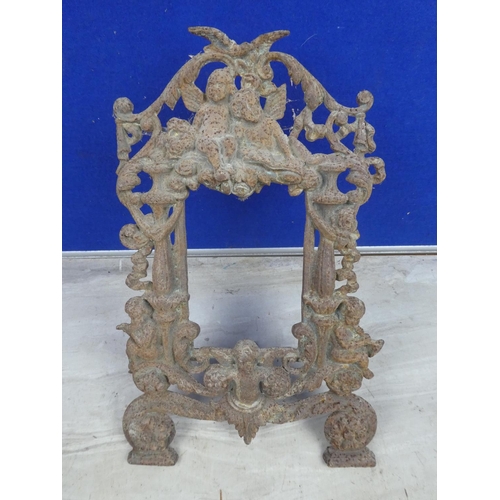 475 - A decorative antique cast iron frame. Approx 23x36cm.