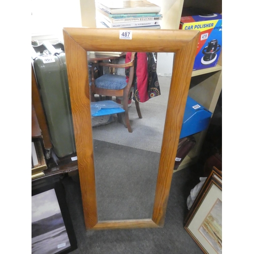 487 - A pine framed wall mirror. Approx 43x105cm.