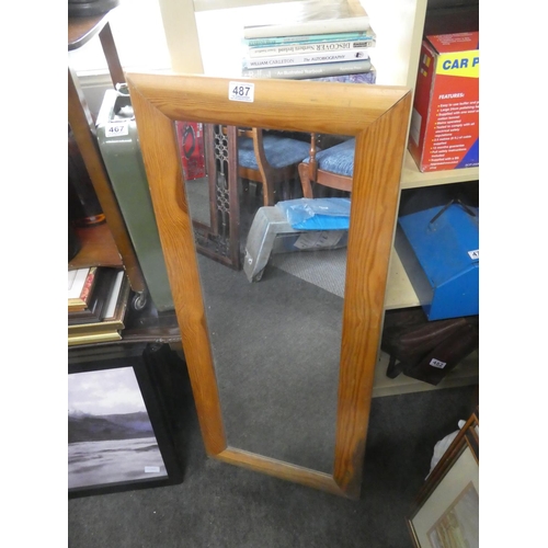 487 - A pine framed wall mirror. Approx 43x105cm.