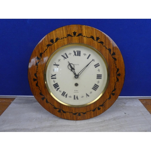 489 - A Wiltic 8 day wall clock with decorative frame.