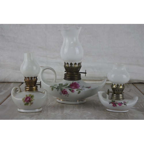 530 - Three small vintage ceramic oil lamps.