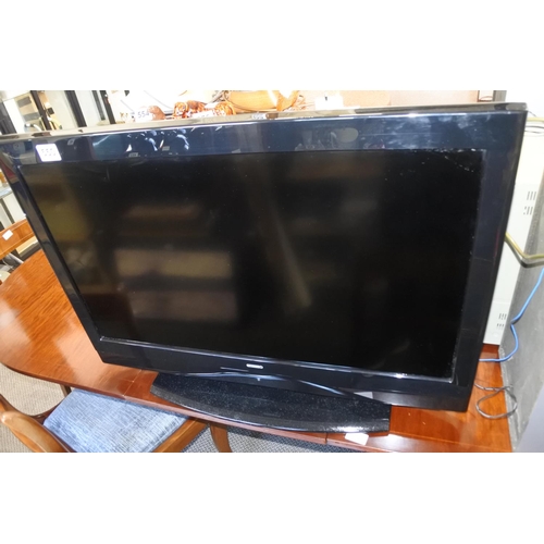 550 - A Digihome flatscreen television, with DVD player. Approx 31inch