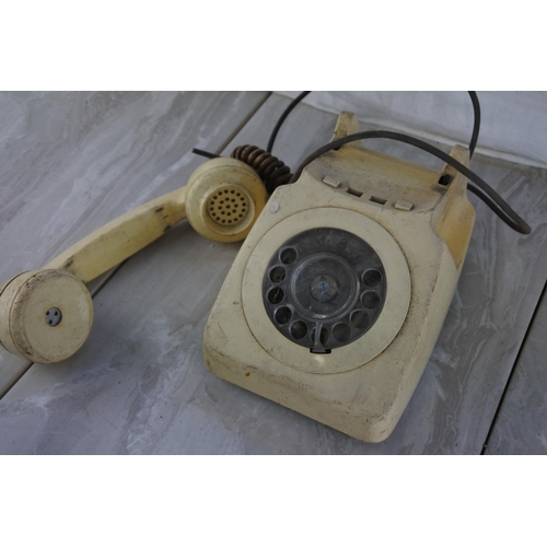 553 - A vintage rotary telephone.