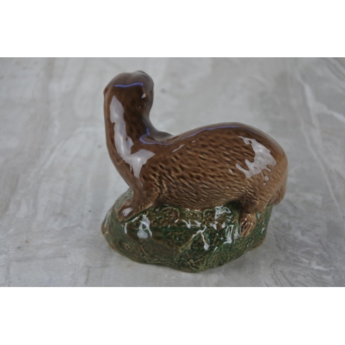 554 - An ornamental miniature decanter in the form of an otter by Beswick for Beneagles Scotch Whisky mode... 