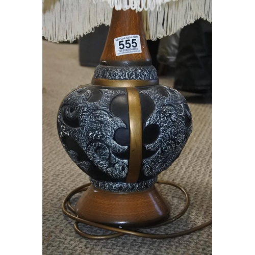 555 - A vintage ceramic table lamp and shade. Approx 66cm tall.