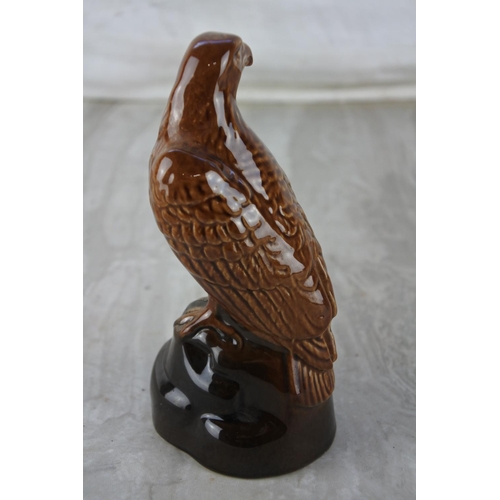 557 - An ornamental miniature decanter in the form of a golden eagle modelled by J G Tongue 1969, made by ... 