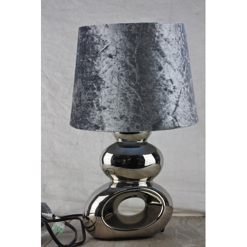 560 - A table lamp and base.