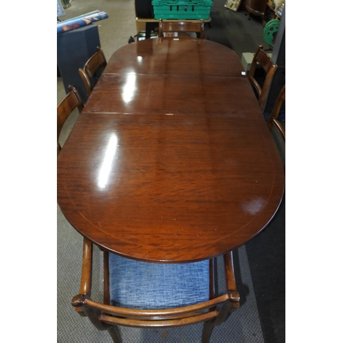 568 - A mahogany dining room table and six chairs set. Approx 90x195x75cm.