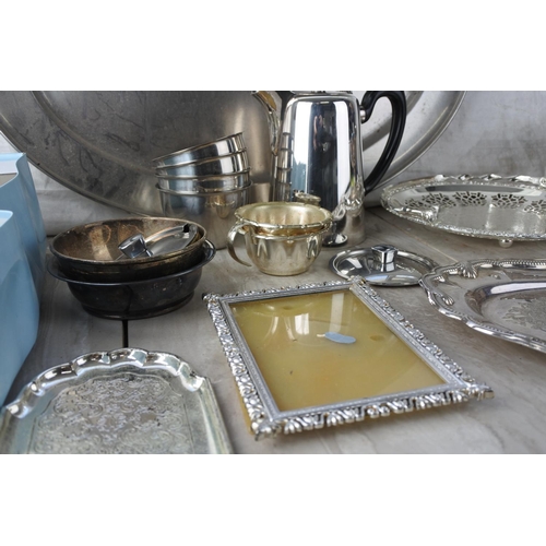 581 - A box of assorted silver plate ware, cutlery, trays and more.