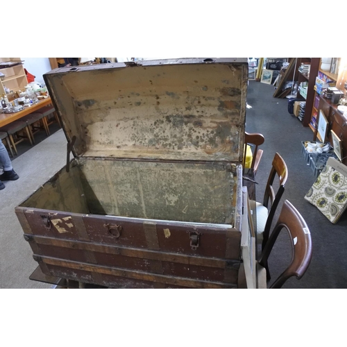 587 - An antique dome lidded trunk. Approx 91x55x47cm.