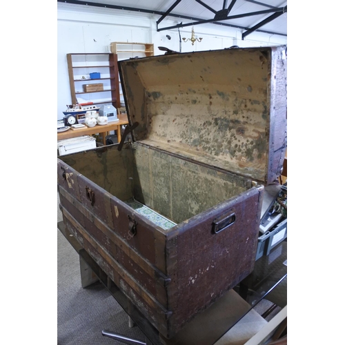 587 - An antique dome lidded trunk. Approx 91x55x47cm.