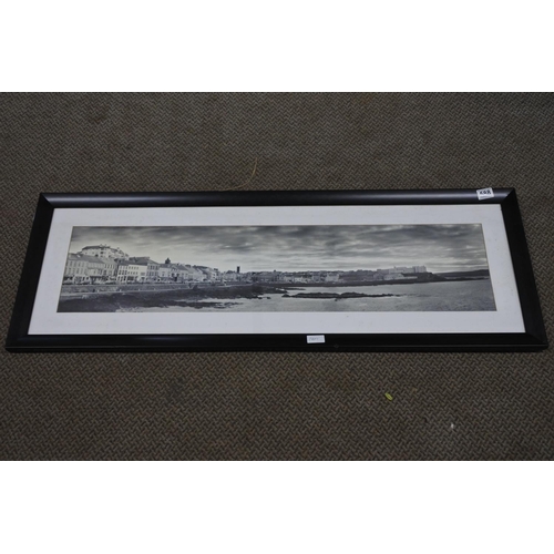 588 - A large framed vintage photograph of Portstewart promenade. Approx 118x41cm.