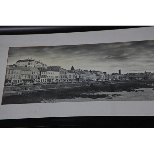 588 - A large framed vintage photograph of Portstewart promenade. Approx 118x41cm.