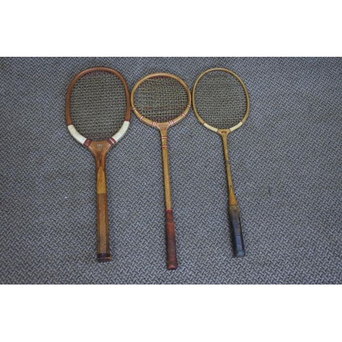 593 - Three vintage Manchester College logo squash, tennis and badminton rackets.