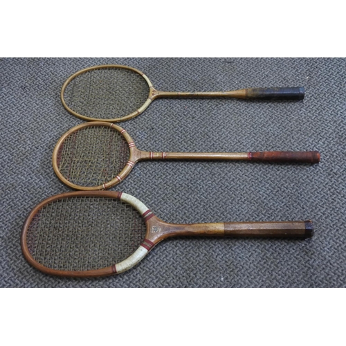 593 - Three vintage Manchester College logo squash, tennis and badminton rackets.