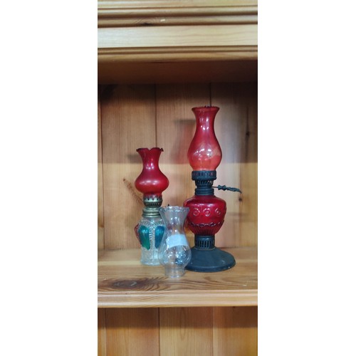 1 - Two vintage oil lamps and spare glass chimney.