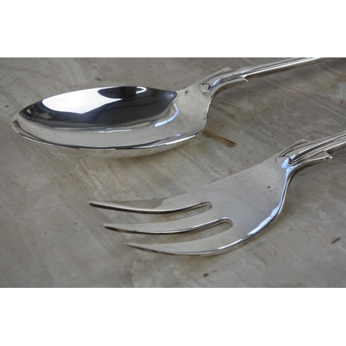 717 - A large silver plated serving fork and spoon.