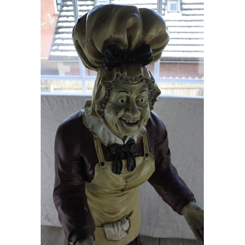 725 - A large statue of an old lady waitress.  Approx 85cm.