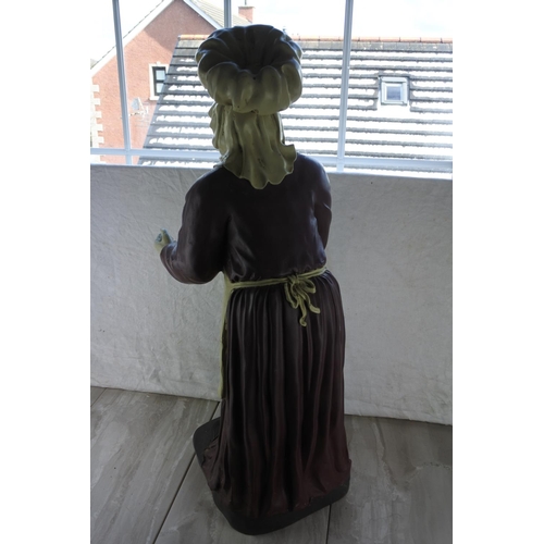 725 - A large statue of an old lady waitress.  Approx 85cm.