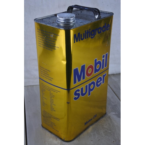 734 - A Mobil Super motor oil can and contents.