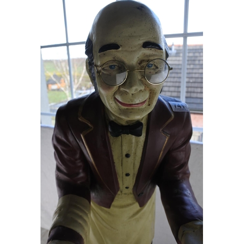 741 - A large statue of an old man waiter.  Approx 95cm.