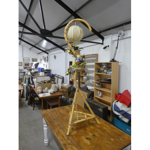 756 - A vintage bamboo standard lamp with three rattan flower basket.  Approx 170cm.