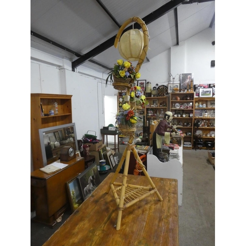 756 - A vintage bamboo standard lamp with three rattan flower basket.  Approx 170cm.