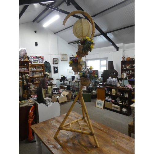 756 - A vintage bamboo standard lamp with three rattan flower basket.  Approx 170cm.