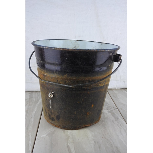 776 - A vintage black enamel bucket.