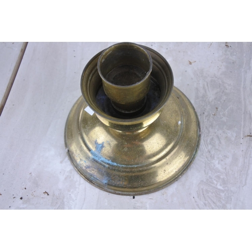 787 - A brass candle holder.