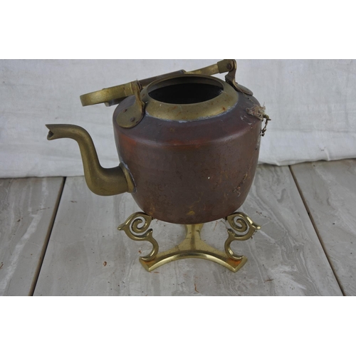 792 - A brass and copper spirit kettle on stand (missing lid).