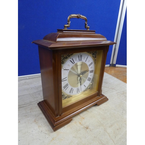 805 - A wooden cased Rhythm mantle clock.