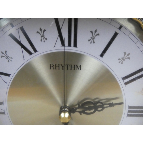 805 - A wooden cased Rhythm mantle clock.