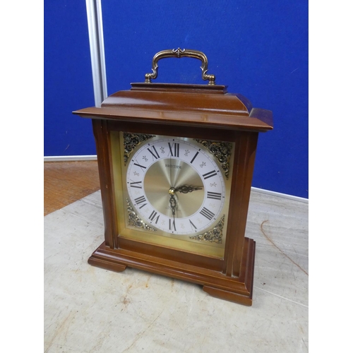 805 - A wooden cased Rhythm mantle clock.