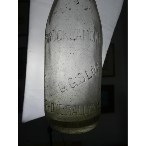 806 - A collection of vintage dairy bottles to include Co op, Brocklamont and more.