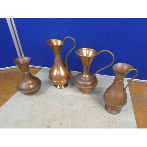 808 - A lot of four vintage copper and brass jugs. Tallest  Approx 29cm.