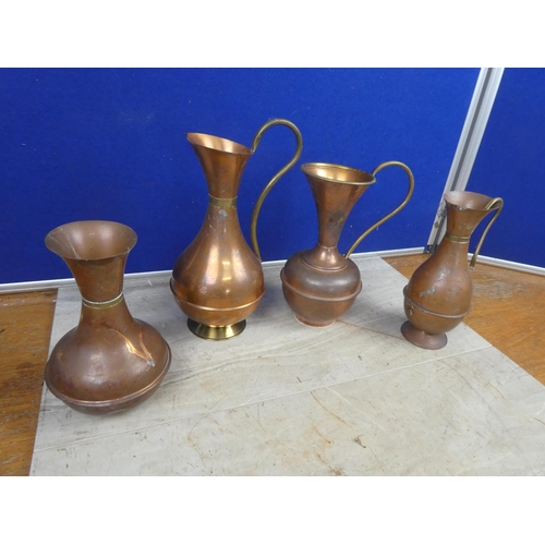 808 - A lot of four vintage copper and brass jugs. Tallest  Approx 29cm.