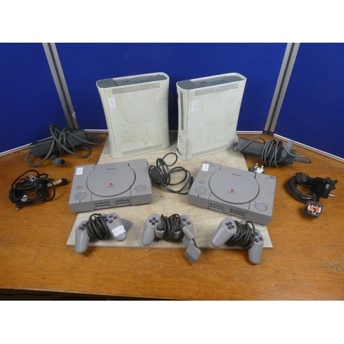 810 - Two XBOX 360 consoles and controllers.