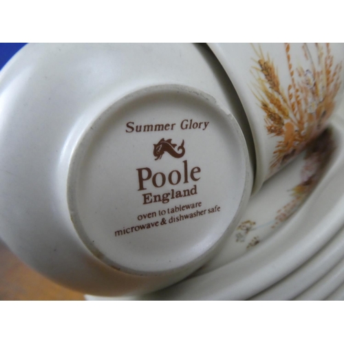 824 - A large collection of Poole pottery 'Summer Glory'.