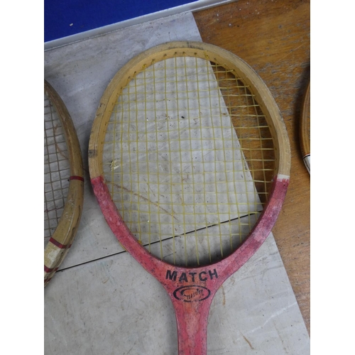 827 - A vintage Improved badminton racket, a vintage Waratah tennis racket and two others.